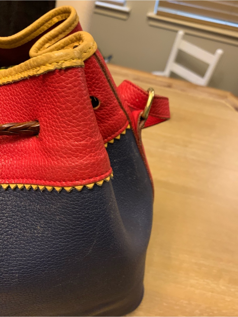 Dooney & Bourke Navy, Red & Yellow Leather Drawstring Bucket Bag - Picture 12 of 16